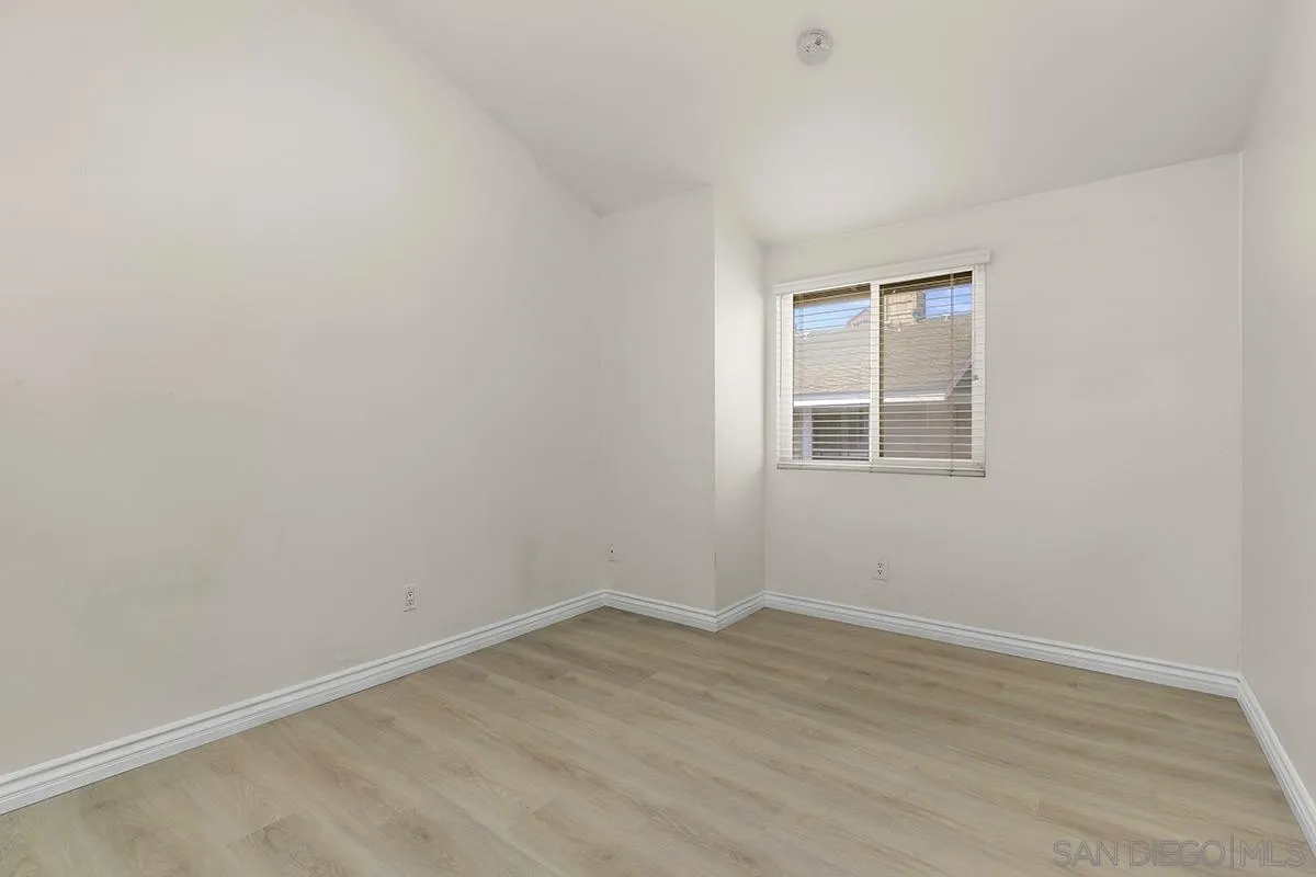 4028 Mahaila Avenue, Unit C San Diego, CA 92122 - Photo 30 of 34 an empty room with a window