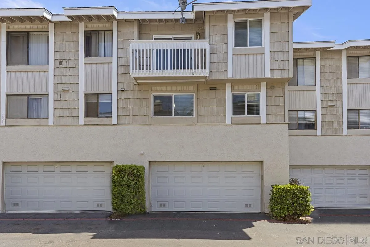 4028 Mahaila Avenue, Unit C San Diego, CA 92122 - Photo 31 of 34 a front view of a house with a parking area