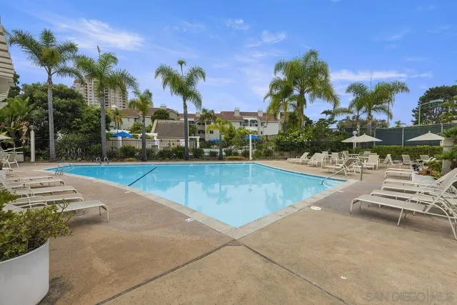 a view of a swimming pool and a yard