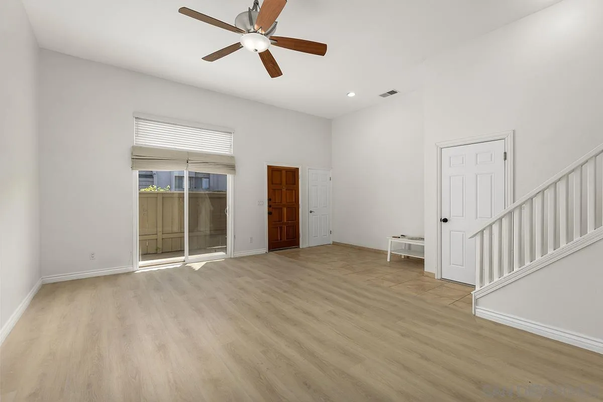 4028 Mahaila Avenue, Unit C San Diego, CA 92122 - Photo 4 of 34 a view of empty room with wooden floor