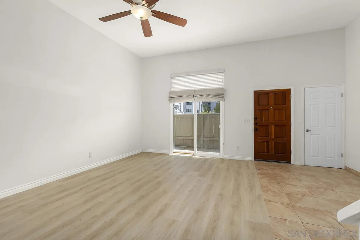 4028 Mahaila Avenue, Unit C San Diego, CA 92122 - Photo 8 of 34 a view of an empty room with a window