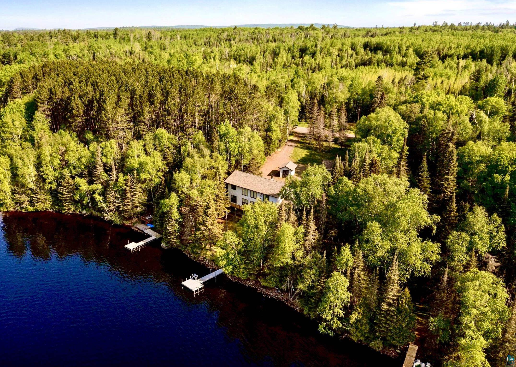 1480 Devil Track Road Grand Marais, MN 55604 - Photo 1 of 38 Aerial front view of property and Devil Track Lake surrounding area with forest