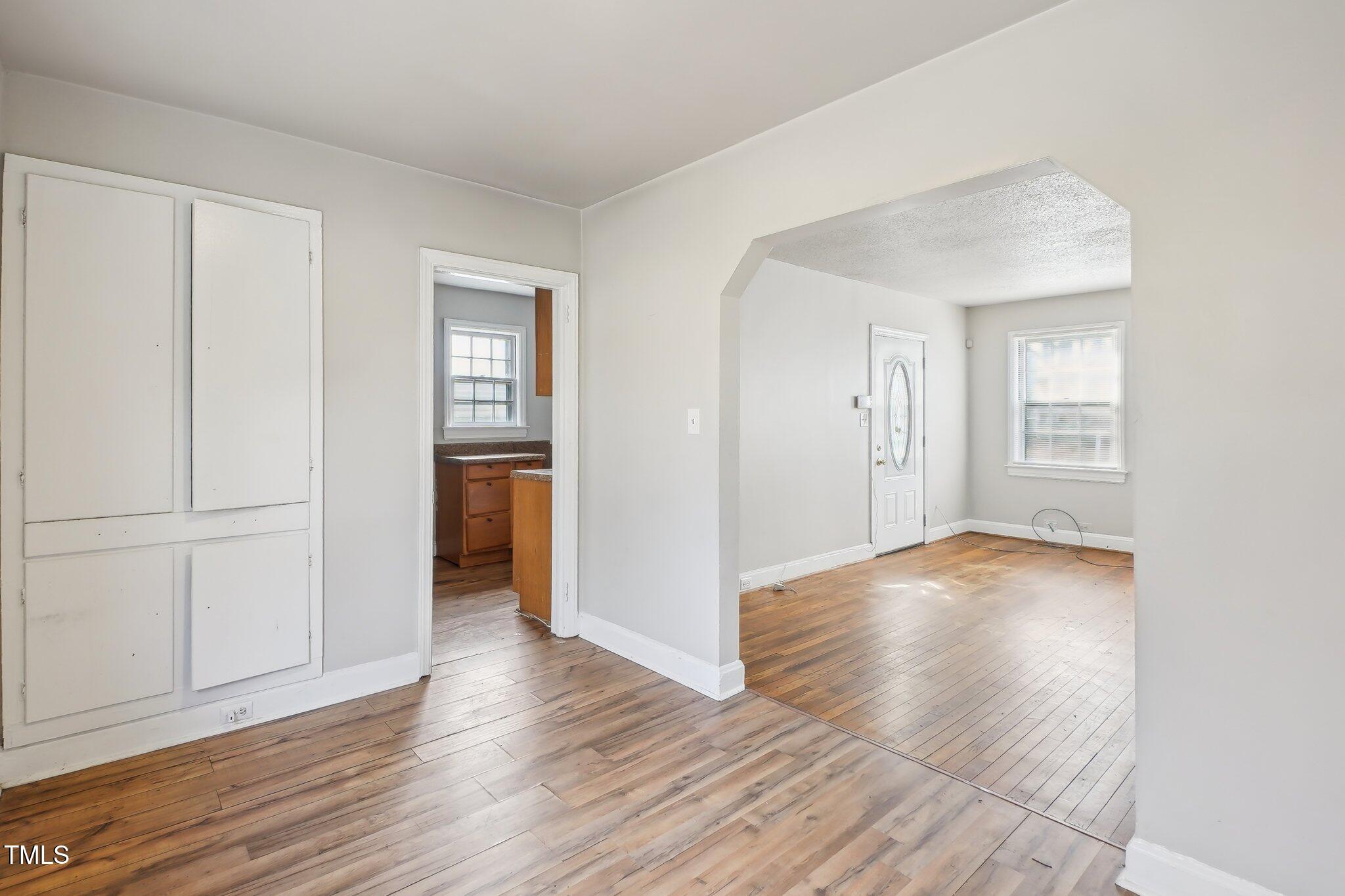 115 Higbee Street Durham, NC 27704 - Photo 11 of 14 an empty room with wooden floor and closet