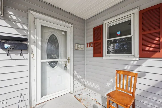 a view of a door and chair in the balcony