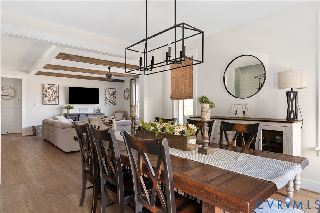 8614 Terroir Lane New Kent, VA 23124 - Photo 14 of 42 a living room with furniture a fireplace and a flat screen tv