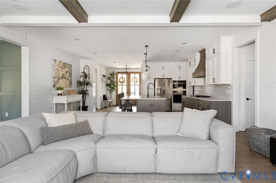 8614 Terroir Lane New Kent, VA 23124 - Photo 17 of 42 a living room with furniture and a large window