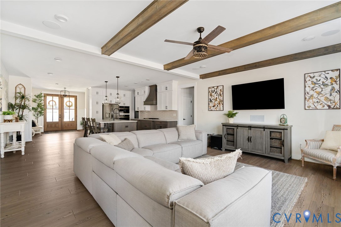 8614 Terroir Lane New Kent, VA 23124 - Photo 18 of 42 a living room with furniture and a flat screen tv
