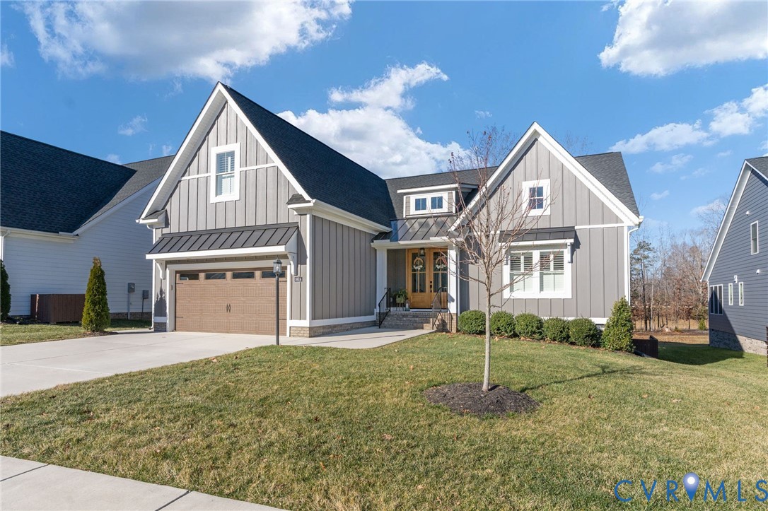 8614 Terroir Lane New Kent, VA 23124 - Photo 2 of 42 a front view of a house with a yard