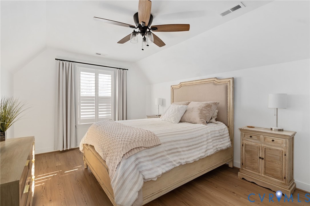 8614 Terroir Lane New Kent, VA 23124 - Photo 30 of 42 a bedroom with a large bed and a window