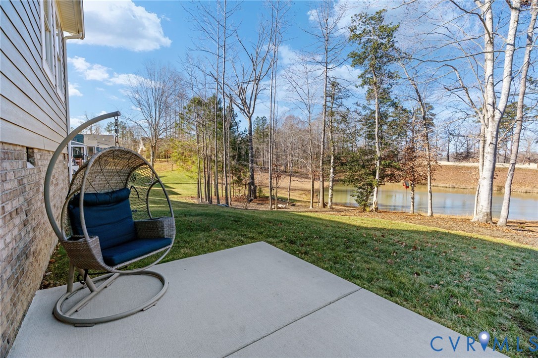 8614 Terroir Lane New Kent, VA 23124 - Photo 38 of 42 a backyard of a house with yard and trampoline