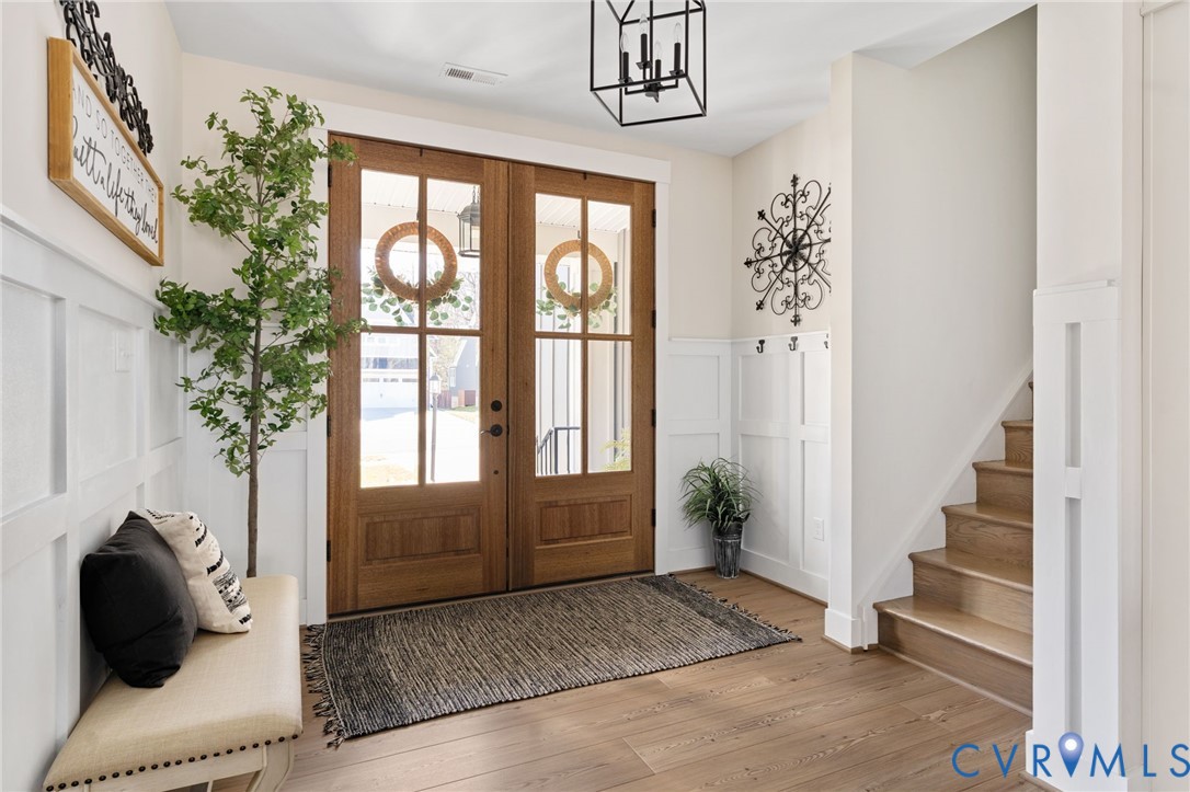 8614 Terroir Lane New Kent, VA 23124 - Photo 4 of 42 a view of entryway and hall with wooden floor