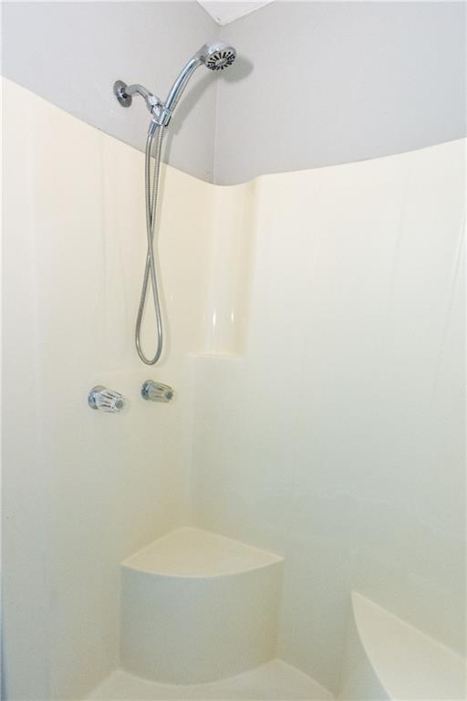 374 McGiboney Road Covington, GA 30016 - Photo 22 of 29 a bathroom with a shower and a toilet