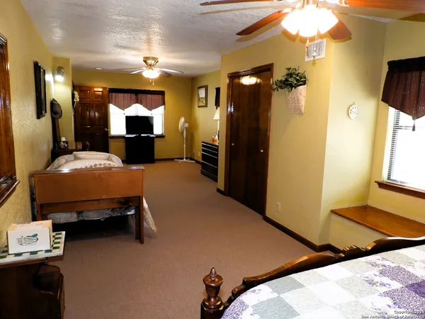 a bedroom with furniture and a bed