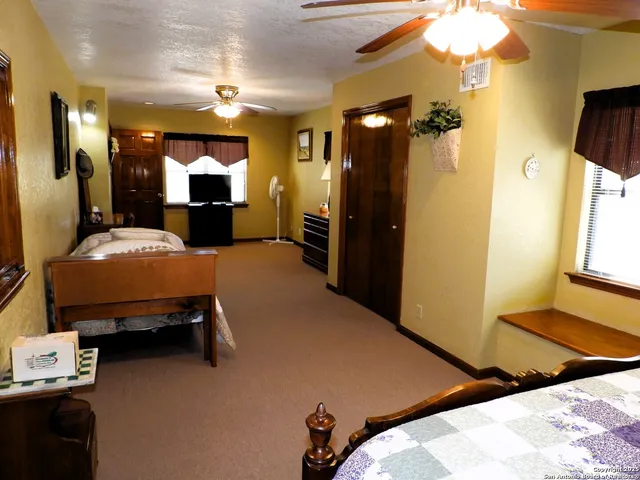 a bedroom with furniture and a bed