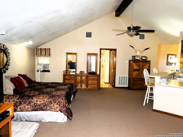 a bed room with furniture and a window