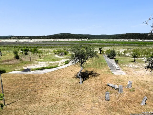 a view of swimming pool with a yard and outdoor seating