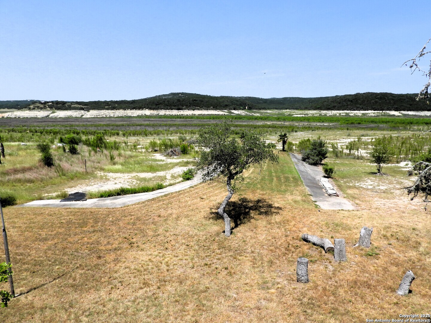 3078 Goat Hill Road Lakehills, TX 78063 - Photo 32 of 38 a view of swimming pool with a yard and outdoor seating