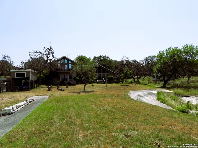 a swimming pool with lots of tress in it