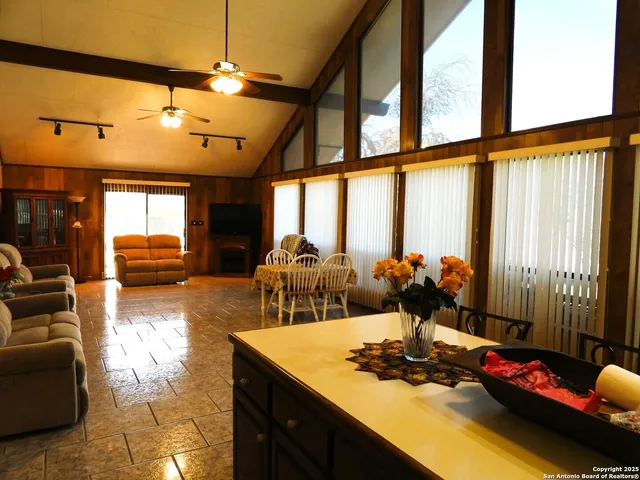 a view of a dining room with furniture window and outside view