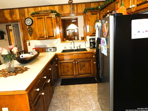 a kitchen with stainless steel appliances a sink and a stove