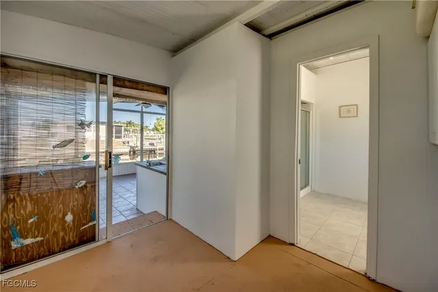 a view of an empty room and window