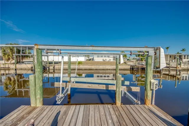 a view of a balcony with floor to ceiling windows with wooden floor