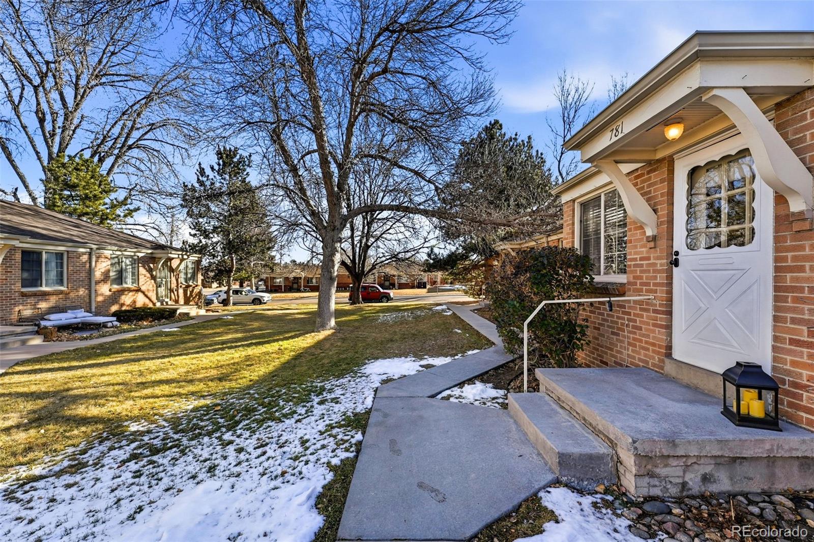 781 Forest Street Denver, CO 80220 - Photo 12 of 19 a view of a house with pool and trees in the background
