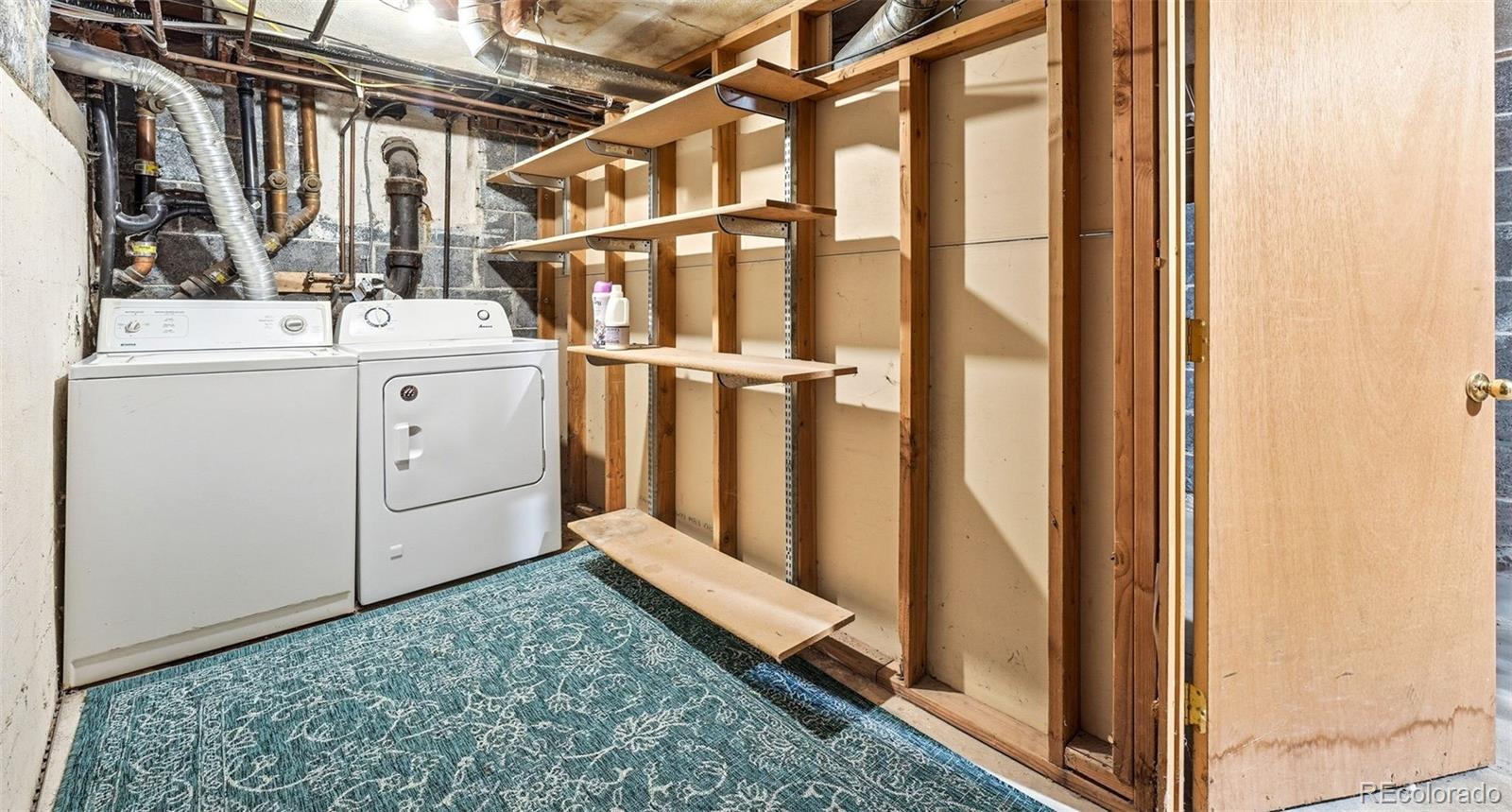 781 Forest Street Denver, CO 80220 - Photo 17 of 19 a utility room with dryer and washer