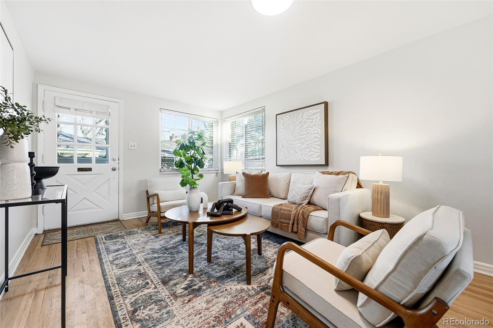 781 Forest Street Denver, CO 80220 - Photo 2 of 19 a living room with furniture and wooden floor