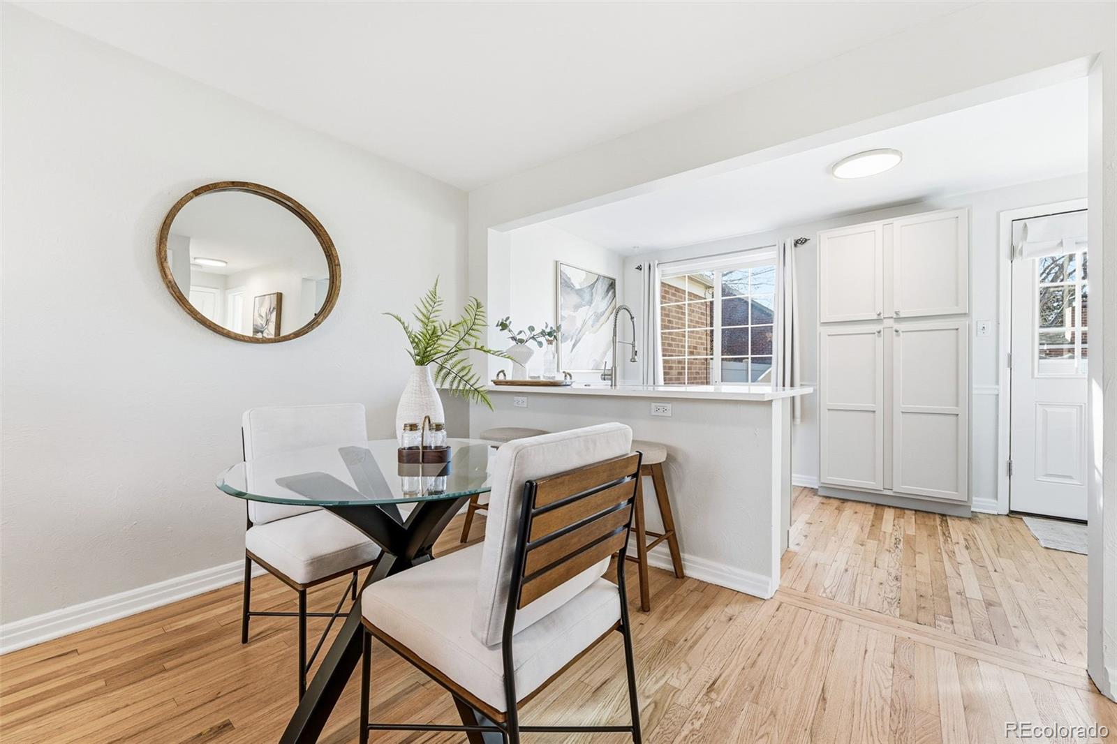 781 Forest Street Denver, CO 80220 - Photo 4 of 19 a view of a livingroom with furniture and wooden floor