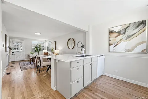 a kitchen with sink and cabinets