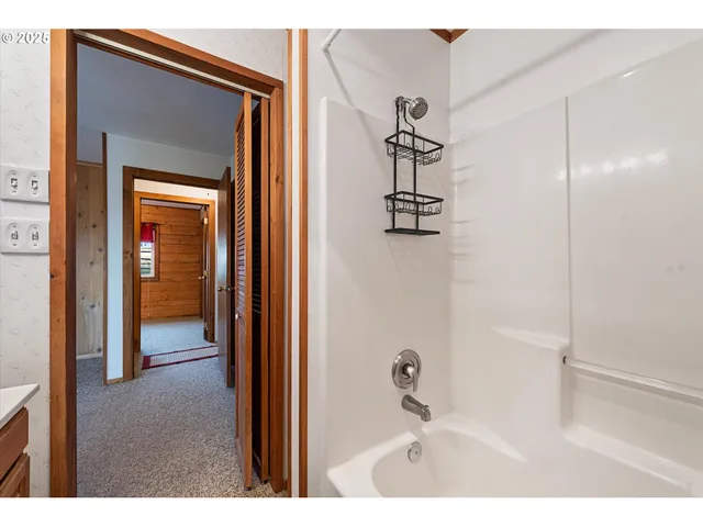 a bedroom with a bed and a view of bathroom