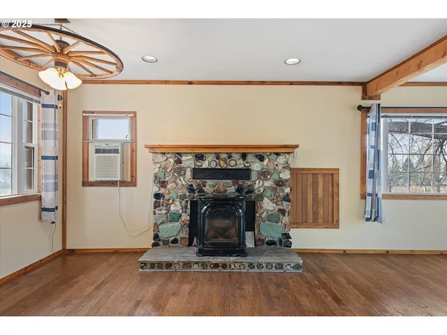 a view of a livingroom with furniture and a fireplace