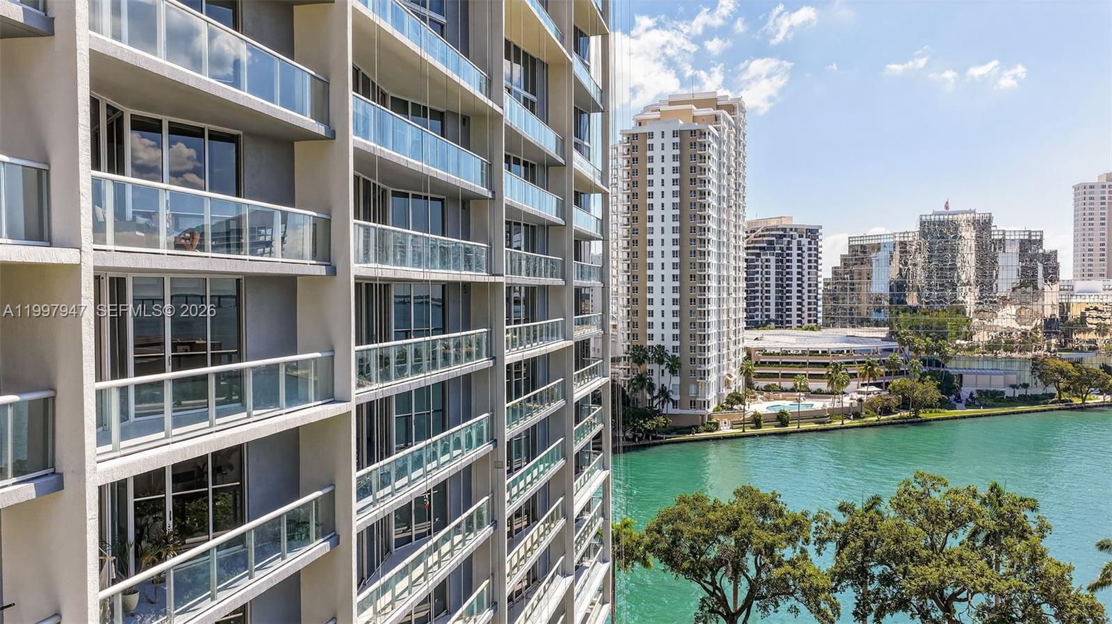 495 Brickell Avenue, Unit 1007 Miami, FL 33131 - Photo 15 of 17 a view of building with yard and seating space