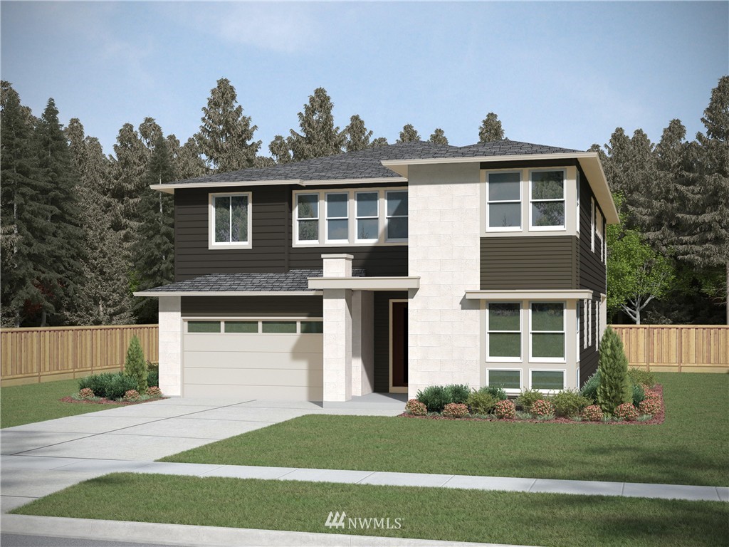 303 Graham Avenue Southeast Renton, WA 98059 - Photo 1 of 4 a front view of a house with a garden