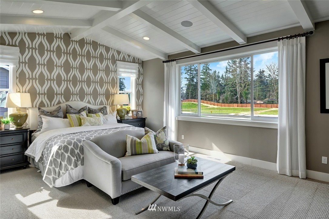 303 Graham Avenue Southeast Renton, WA 98059 - Photo 2 of 4 a bedroom with furniture and a large window