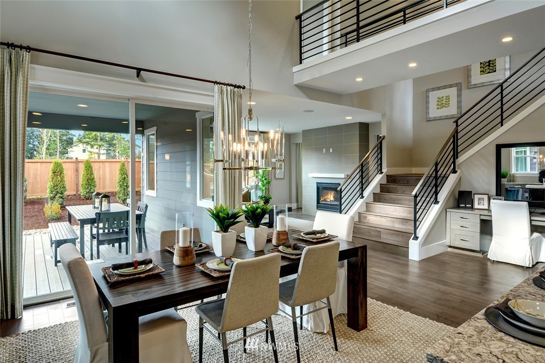 303 Graham Avenue Southeast Renton, WA 98059 - Photo 3 of 4 a dining room with wooden floor and furniture