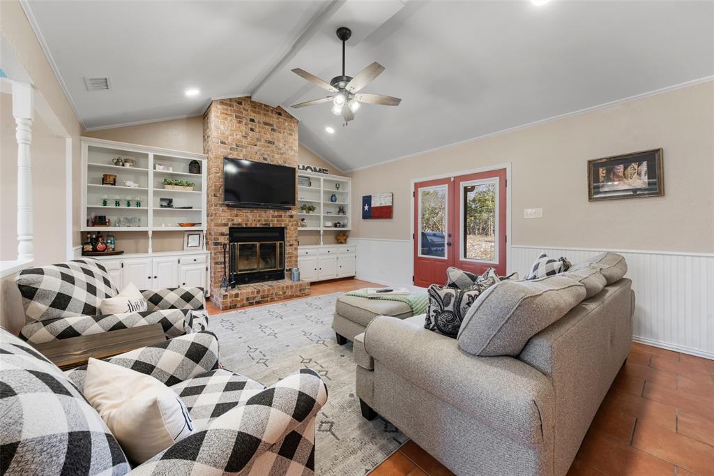 162 High Ridge Drive Bruceville, TX 76630 - Photo 12 of 40 a living room with furniture flat screen tv and a fireplace