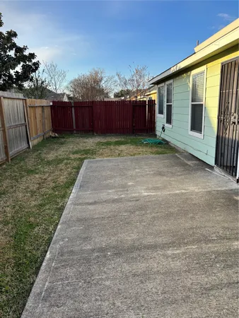 a view of a backyard with potted plants