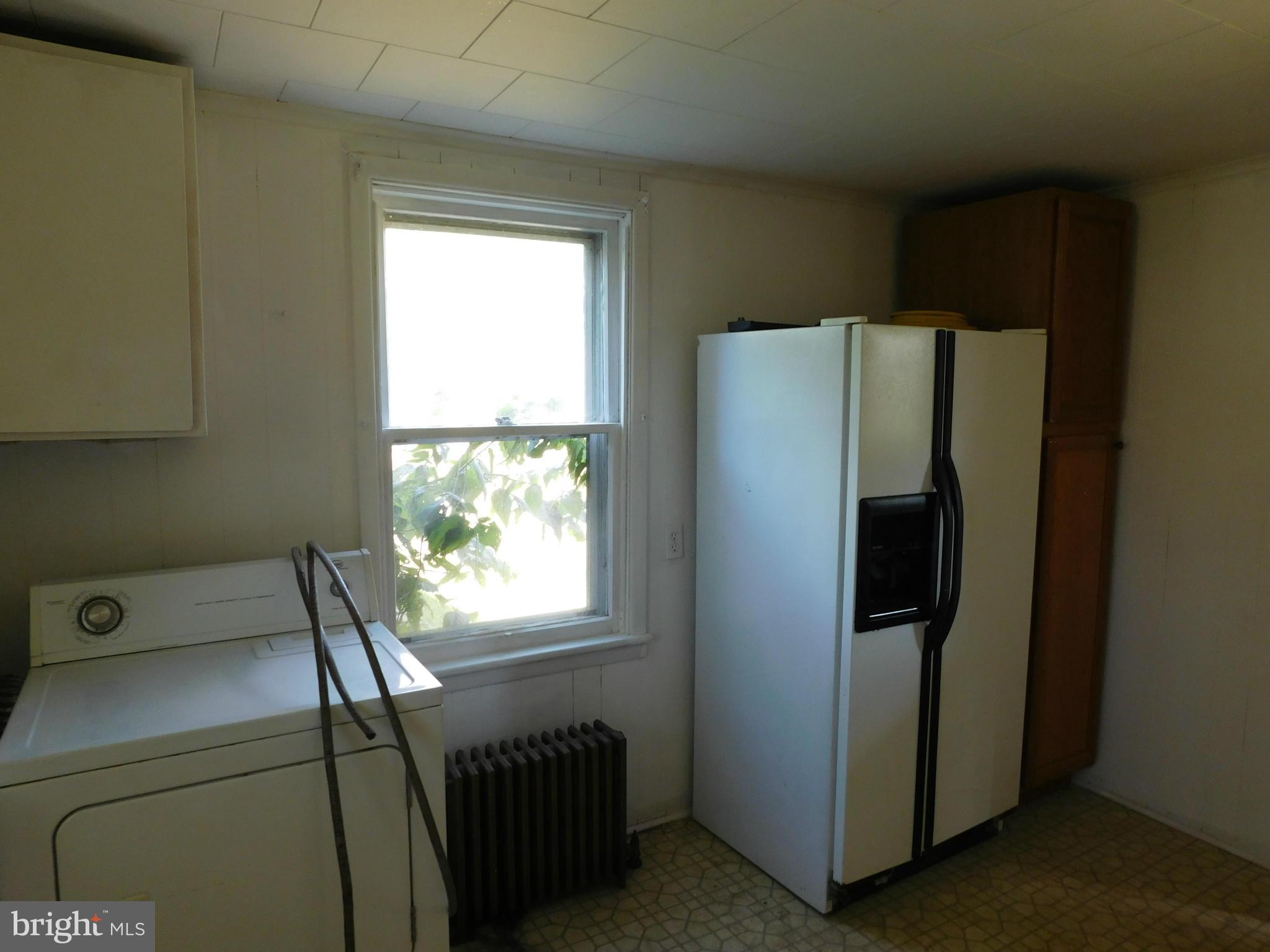 19414 Walnut Hill Road Southwest Barton, MD 21521 - Photo 6 of 15 a room with a window and refrigerator