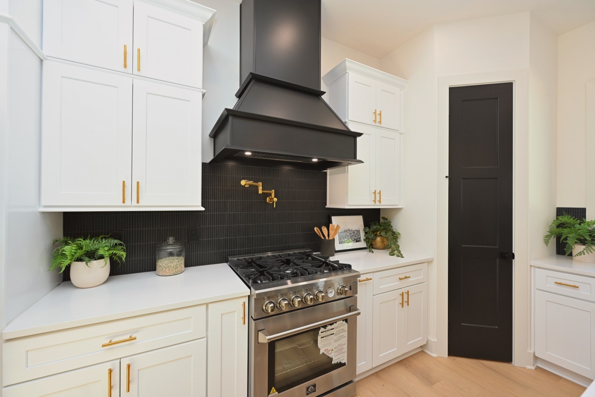 1212 Stockell Street Nashville, TN 37207 - Photo 22 of 86 a kitchen with a stove and a white cabinets