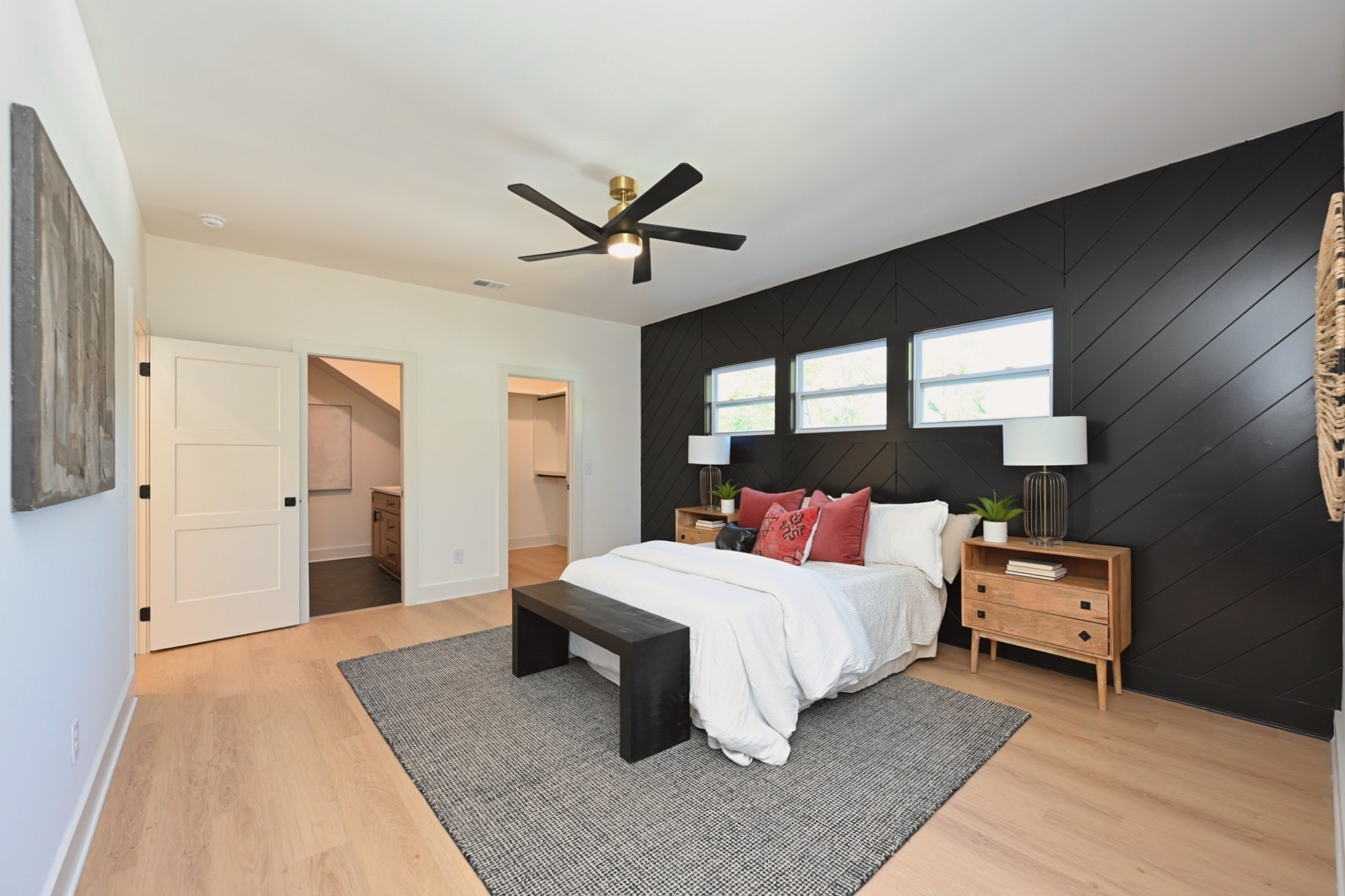 1212 Stockell Street Nashville, TN 37207 - Photo 32 of 86 a bedroom with a large bed and a chandelier