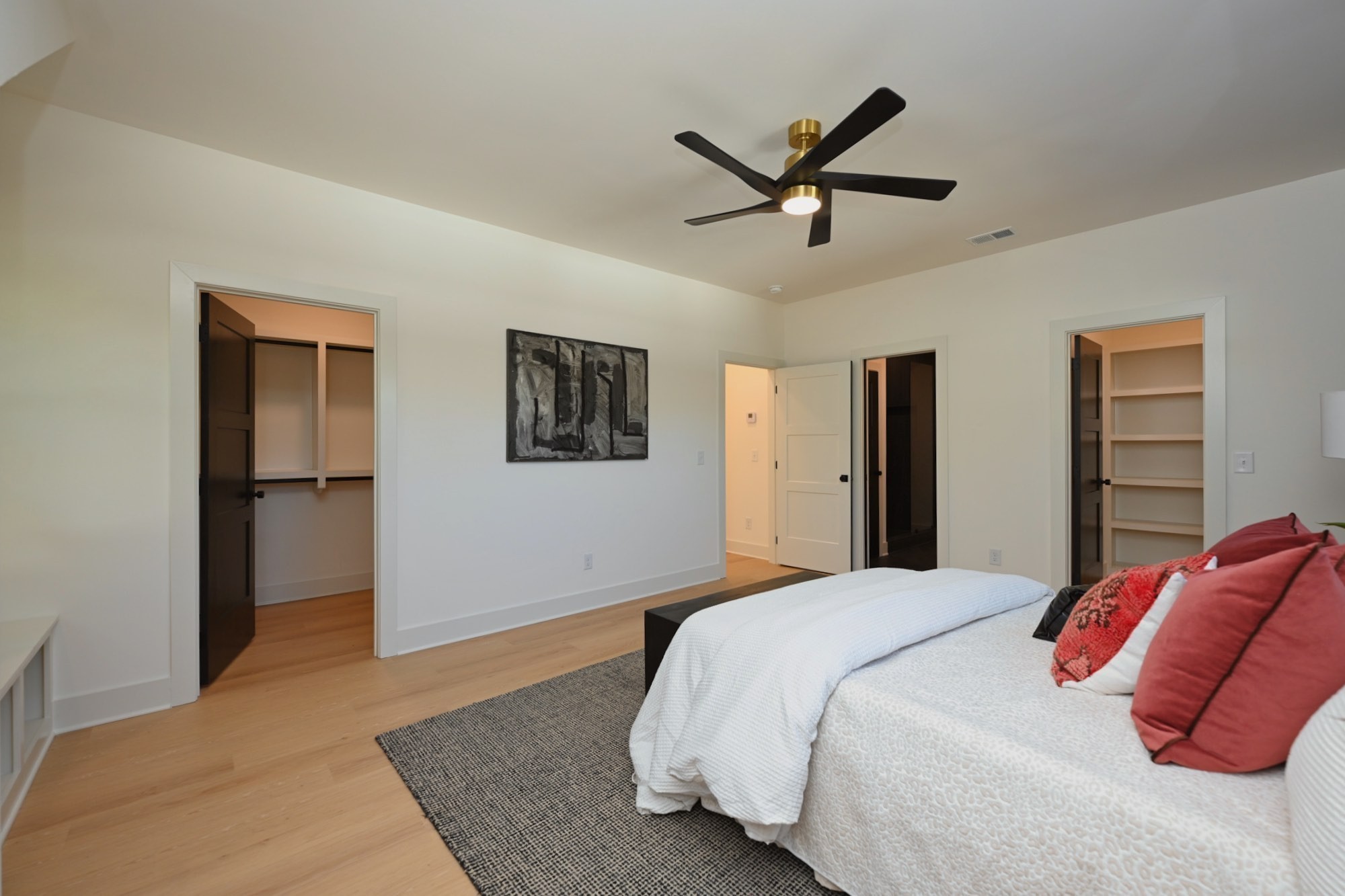 1212 Stockell Street Nashville, TN 37207 - Photo 34 of 86 a bedroom with a large bed and a chandelier