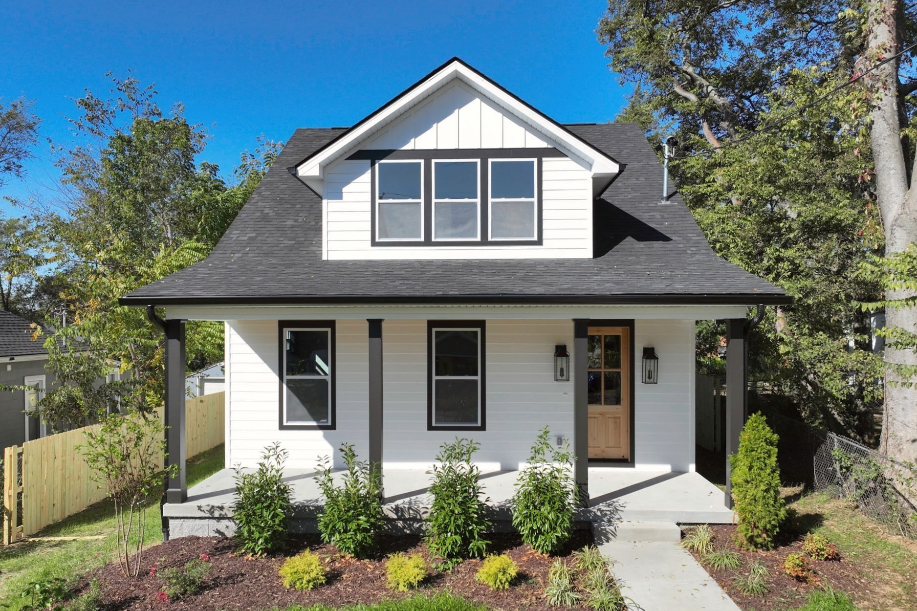 1212 Stockell Street Nashville, TN 37207 - Photo 4 of 86 a front view of a house with garden