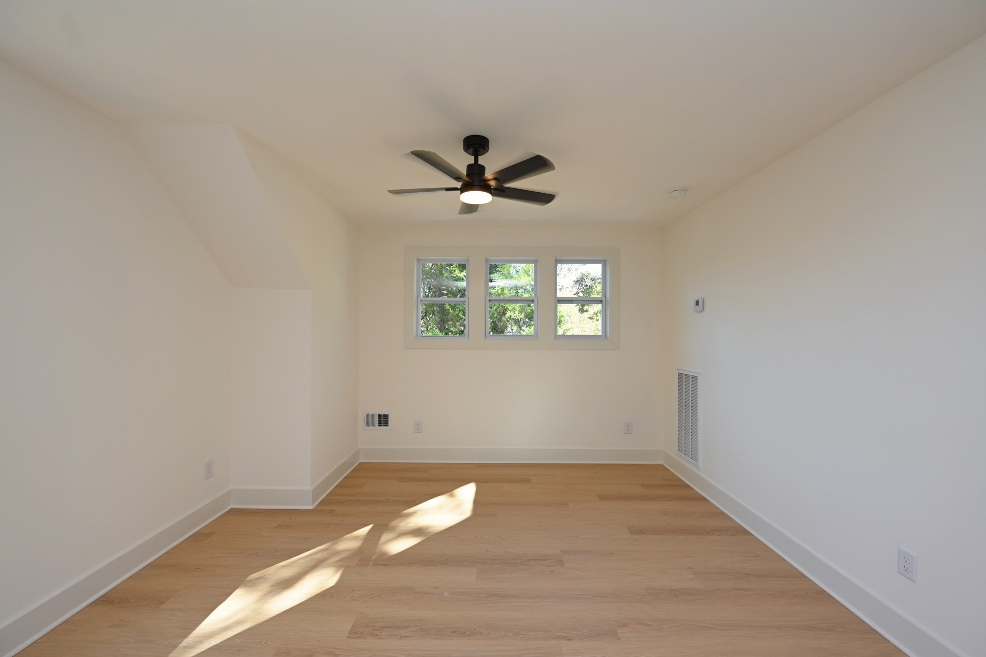 1212 Stockell Street Nashville, TN 37207 - Photo 67 of 86 an empty room with a window and a ceiling fan