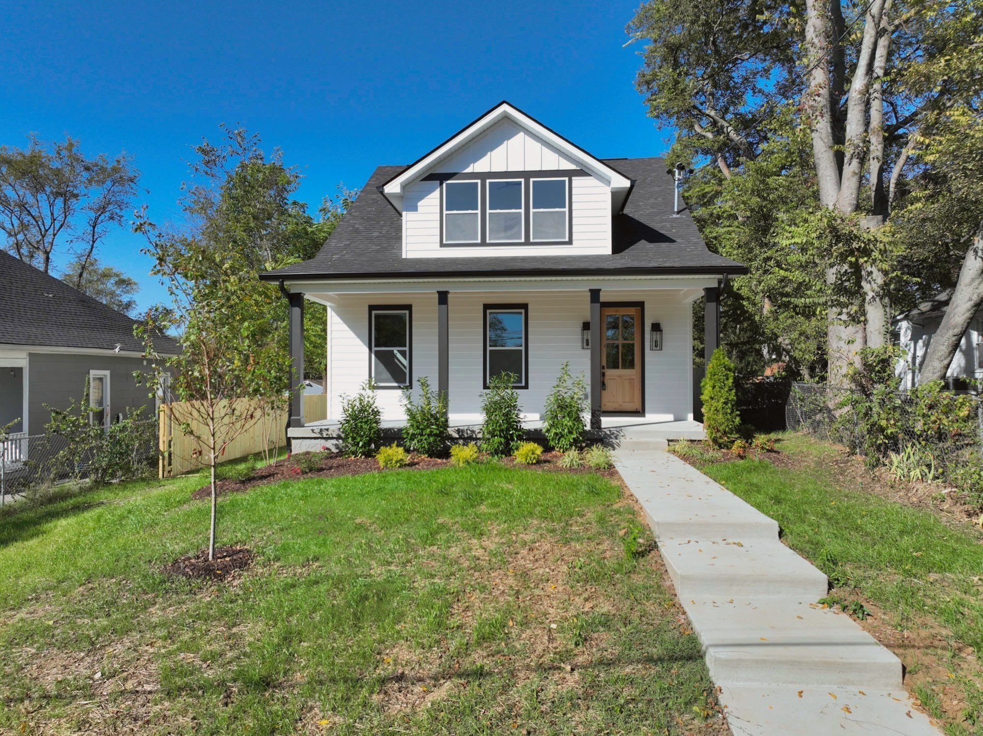 1212 Stockell Street Nashville, TN 37207 - Photo 72 of 86 a front view of a house with a yard