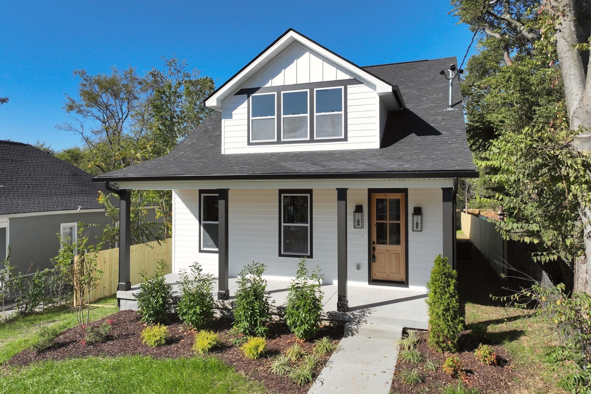 1212 Stockell Street Nashville, TN 37207 - Photo 76 of 86 a front view of a house with a yard