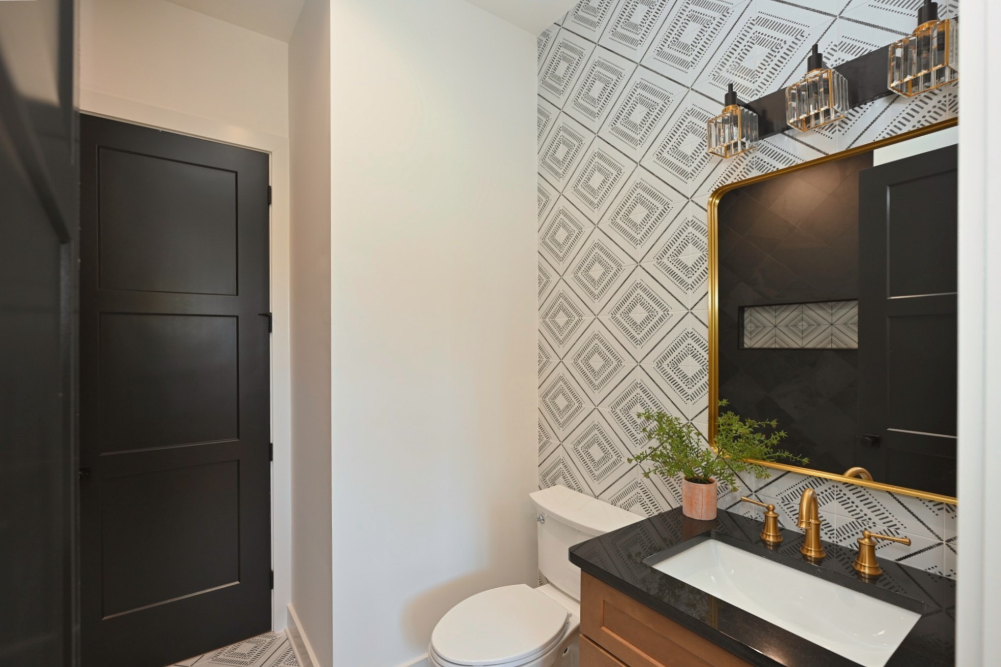 1212 Stockell Street Nashville, TN 37207 - Photo 8 of 86 a bathroom with a sink toilet and mirror