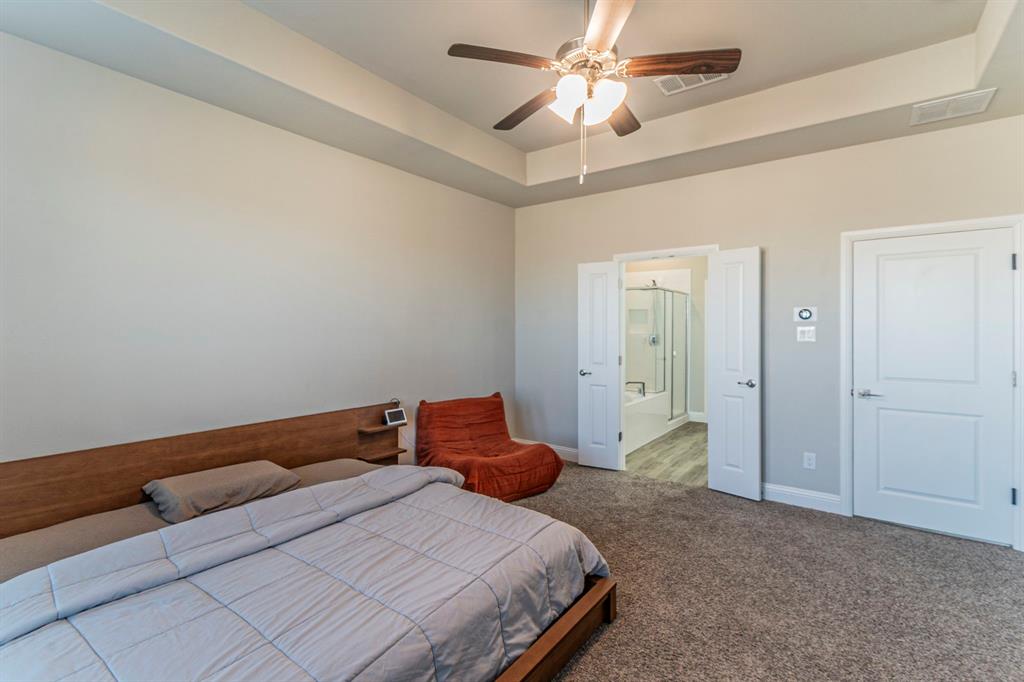 10638 Cherry Tree Way Grand Prairie, TX 76065 - Photo 14 of 39 Another view of the primary bedroom facing the ensuite bathroom