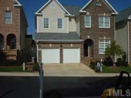 3952 Bentley Bridge Road Raleigh, NC 27612 - Photo 1 of 1 a front view of a house with garden